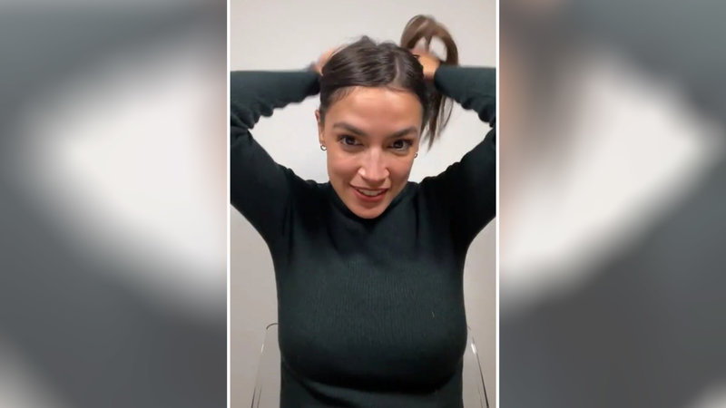 aoc_tying_hair_meme.jpg