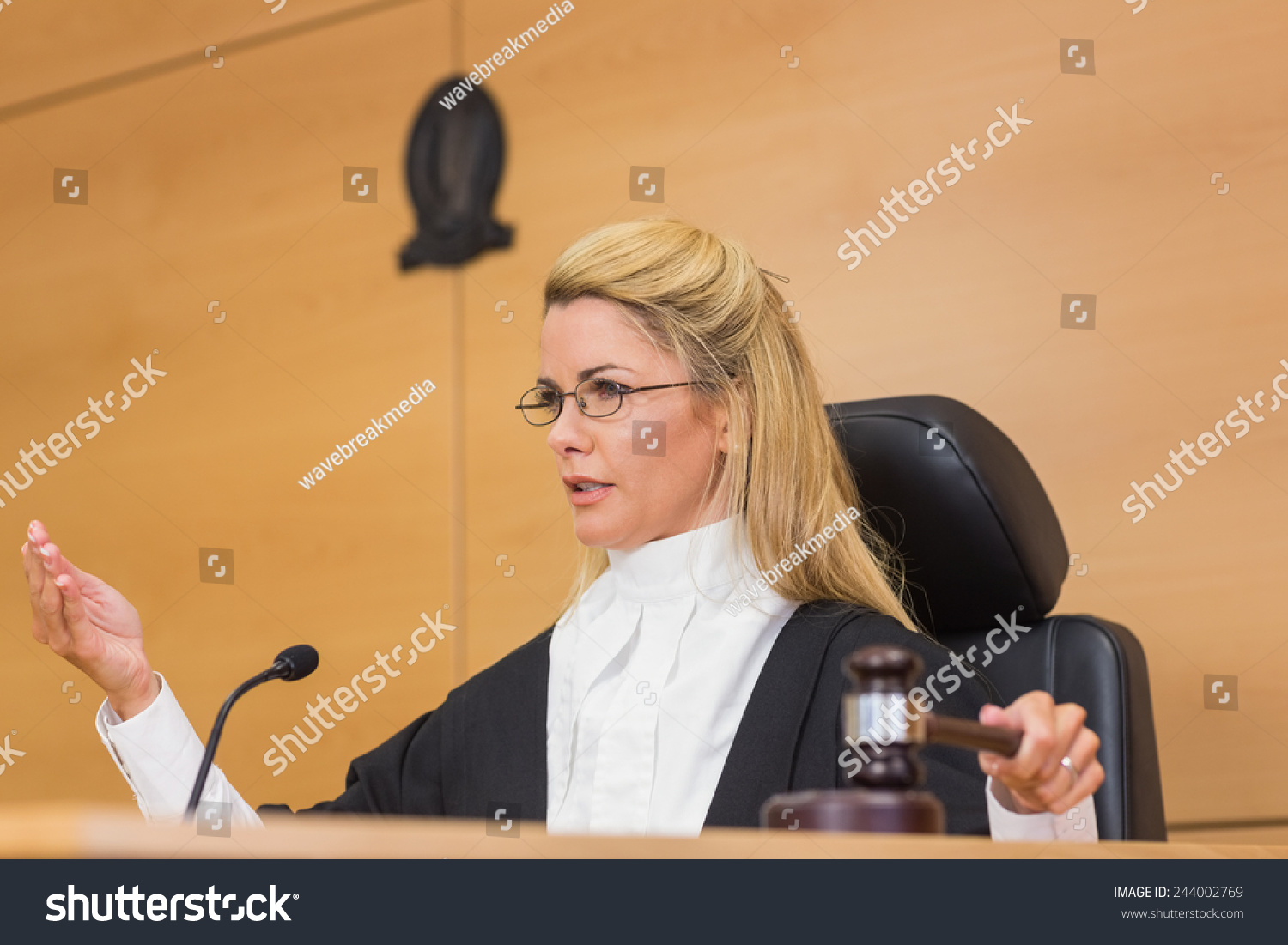 stock-photo-stern-judge-speaking-to-the-court-in-the-court-room-244002769.jpg